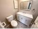 Elegant bathroom featuring modern vanity, mirror, and toilet, offering comfort and style at 8069 Cedar Glen Dr, Charlotte, NC 28212
