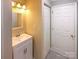 Chic bathroom featuring vanity with sink, mirror, and ample storage, perfect for everyday use at 8069 Cedar Glen Dr, Charlotte, NC 28212