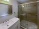 Updated bathroom featuring a glass shower, modern fixtures, and a neutral color scheme for a relaxing experience at 8069 Cedar Glen Dr, Charlotte, NC 28212