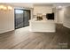 Open-concept layout seamlessly connects the living room and kitchen, offering a cohesive living space at 8069 Cedar Glen Dr, Charlotte, NC 28212