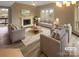 Bright living room featuring neutral walls, modern fireplace, and stylish furniture arrangement at 8069 Cedar Glen Dr, Charlotte, NC 28212