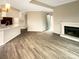 Inviting living room showcases fireplace, open floor plan, and seamless flow to kitchen at 8069 Cedar Glen Dr, Charlotte, NC 28212