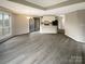 Bright living room featuring hardwood floors, recessed lighting, and open access to the kitchen at 8069 Cedar Glen Dr, Charlotte, NC 28212