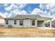 Back of home featuring gray siding, covered back porch, and level lot at 8716 Acadia Pkwy # 596, Sherrills Ford, NC 28673