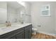 Bright bathroom with double sink vanity, neutral walls, and a large mirror at 8716 Acadia Pkwy # 596, Sherrills Ford, NC 28673
