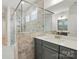 Modern bathroom features glass-enclosed shower, tile surround, and vanity with quartz countertop at 8716 Acadia Pkwy # 596, Sherrills Ford, NC 28673
