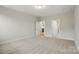 Spacious carpeted bedroom with hallway entry to kitchen and access to en suite bathroom at 8716 Acadia Pkwy # 596, Sherrills Ford, NC 28673