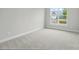 Bright, carpeted bedroom with a large window offering abundant natural light at 8716 Acadia Pkwy # 596, Sherrills Ford, NC 28673