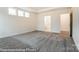 Spacious bedroom featuring plush gray carpet and ample natural light from the windows at 8716 Acadia Pkwy # 596, Sherrills Ford, NC 28673