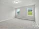 Bright, carpeted bedroom with two large windows offering outdoor views at 8716 Acadia Pkwy # 596, Sherrills Ford, NC 28673