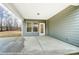 This covered patio featuring a concrete floor and neutral walls offers a serene retreat for relaxation at 8716 Acadia Pkwy # 596, Sherrills Ford, NC 28673
