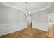 Dining room features wood floors, crown molding, and an elegant chandelier at 8716 Acadia Pkwy # 596, Sherrills Ford, NC 28673