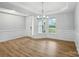 Bright dining room with wood floors, crown molding and large windows and stylish chandelier at 8716 Acadia Pkwy # 596, Sherrills Ford, NC 28673