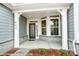 Inviting front entrance featuring decorative glass door, sidelights, and stylish stone accents at 8716 Acadia Pkwy # 596, Sherrills Ford, NC 28673