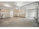 Unfinished two-car garage showing the concrete flooring and garage door at 8716 Acadia Pkwy # 596, Sherrills Ford, NC 28673