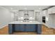 Bright open kitchen featuring a large island, stainless appliances, and modern lighting at 8716 Acadia Pkwy # 596, Sherrills Ford, NC 28673