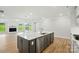 Spacious kitchen island with stainless steel dishwasher and sink overlooks the living area at 8716 Acadia Pkwy # 596, Sherrills Ford, NC 28673