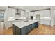 Bright open kitchen featuring a large island, stainless appliances, and modern lighting at 8716 Acadia Pkwy # 596, Sherrills Ford, NC 28673