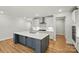 Bright open kitchen featuring a large island, stainless appliances, and modern lighting at 8716 Acadia Pkwy # 596, Sherrills Ford, NC 28673