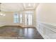 Spacious room featuring tray ceiling, decorative molding, beautiful hardwood floors, and abundant natural light at 8716 Acadia Pkwy # 596, Sherrills Ford, NC 28673