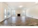 Spacious living room with hardwood floors, fireplace, and large windows offering plenty of natural light at 8716 Acadia Pkwy # 596, Sherrills Ford, NC 28673