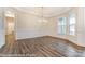 Open floor plan featuring hardwood floors, white trim, and modern chandelier at 8716 Acadia Pkwy # 596, Sherrills Ford, NC 28673