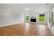Bright living room featuring a fireplace, windows with a green view, and wood-look floors at 8716 Acadia Pkwy # 596, Sherrills Ford, NC 28673