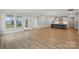 Open living room featuring a kitchen, access to the outside, and wood-look floors at 8716 Acadia Pkwy # 596, Sherrills Ford, NC 28673