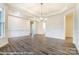 Open floor plan featuring hardwood floors, white trim, and modern chandelier at 8716 Acadia Pkwy # 596, Sherrills Ford, NC 28673