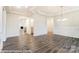 Open floor plan featuring hardwood floors, white trim and modern chandelier at 8716 Acadia Pkwy # 596, Sherrills Ford, NC 28673