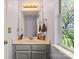 Cozy bathroom with a single vanity, a framed mirror and a window with natural light at 9108 Clifton Meadow Dr, Matthews, NC 28105