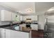 Stylish kitchen with stainless steel appliances, granite countertops, and white cabinetry at 9108 Clifton Meadow Dr, Matthews, NC 28105