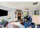 Inviting living room featuring a brick fireplace, ample natural light, and cozy, stylish furnishings at 9108 Clifton Meadow Dr, Matthews, NC 28105