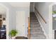 Inviting entrance foyer with a carpeted staircase and view to the upper level at 9108 Clifton Meadow Dr, Matthews, NC 28105