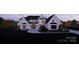 Beautiful two-story home with a brick exterior, black trim windows, manicured lawn, and professional landscaping at 1017 Broadmoor Dr # 60, Marvin, NC 28173