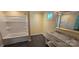 Bathroom featuring a bathtub with shower, a vanity, and a large mirror at 1024 Old Mountain View Rd, Mount Holly, NC 28120