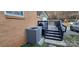 Exterior of home features A/C unit, wooden deck and brick at 1024 Old Mountain View Rd, Mount Holly, NC 28120