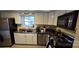 Well-equipped kitchen with white cabinetry and stainless steel appliances for cooking at 1024 Old Mountain View Rd, Mount Holly, NC 28120