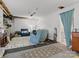 Unfinished basement rec room with blue recliners, rug, and plenty of potential at 10700 Summitt Tree Ct, Charlotte, NC 28277