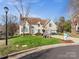 Charming two-story home with a well-manicured lawn, attached garage, and inviting curb appeal at 10700 Summitt Tree Ct, Charlotte, NC 28277