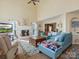 Bright, airy living room features vaulted ceilings, a cozy fireplace, and stylish furnishings at 10700 Summitt Tree Ct, Charlotte, NC 28277