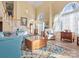 Bright, airy living room features vaulted ceilings, stairs, and stylish furnishings at 10700 Summitt Tree Ct, Charlotte, NC 28277