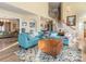 Bright, airy living room features vaulted ceilings, stairs, and stylish furnishings at 10700 Summitt Tree Ct, Charlotte, NC 28277