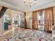 Open floorplan living room features hardwood floors, natural light, and access to adjoining rooms at 10700 Summitt Tree Ct, Charlotte, NC 28277