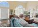 Bright, airy living room features vaulted ceilings, and stylish furnishings at 10700 Summitt Tree Ct, Charlotte, NC 28277