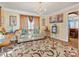 Comfortable living room features a decorative rug, neutral sofa, and ample natural light at 10700 Summitt Tree Ct, Charlotte, NC 28277