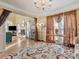 Open floorplan living room features hardwood floors, natural light, and access to adjoining rooms at 10700 Summitt Tree Ct, Charlotte, NC 28277