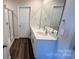 Modern bathroom featuring a double sink vanity, framed mirror, and a glass-enclosed shower at 1105 Harry Ct, Albemarle, NC 28001