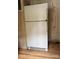 View of a kitchen featuring a white refrigerator and wood-style vinyl flooring at 13080 Philadelphia Church Rd, Oakboro, NC 28129