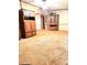 Open living room with neutral color walls and carpeted flooring, offering ample space at 13080 Philadelphia Church Rd, Oakboro, NC 28129